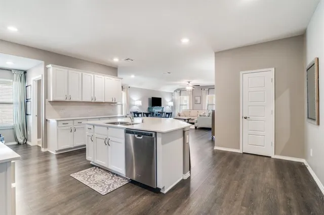 a kitchen with a sink stove and refrigerator