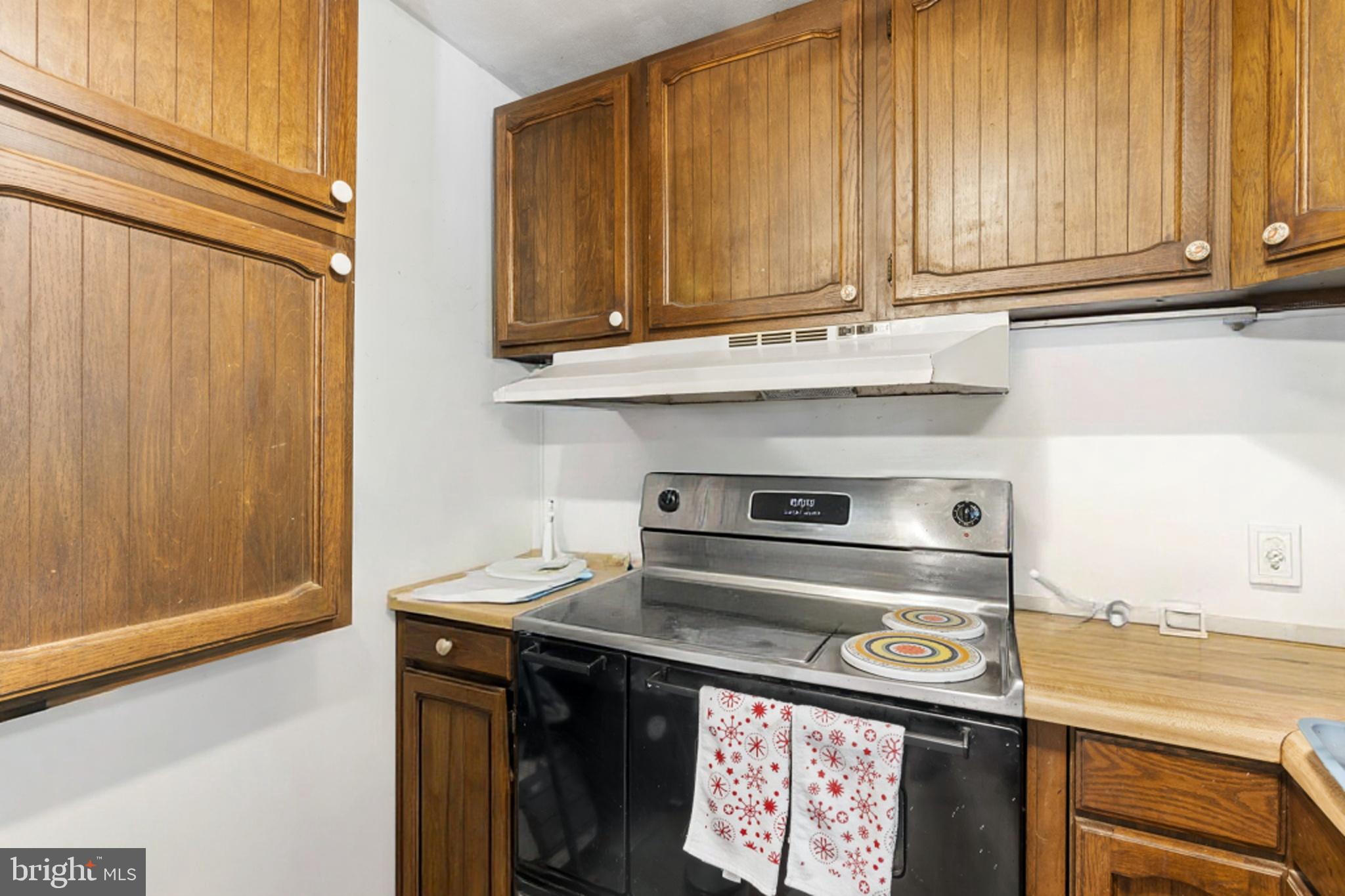 52 Carol Lane Malvern, PA 19355 - Photo 13 of 14 a stove top oven sitting inside of a kitchen
