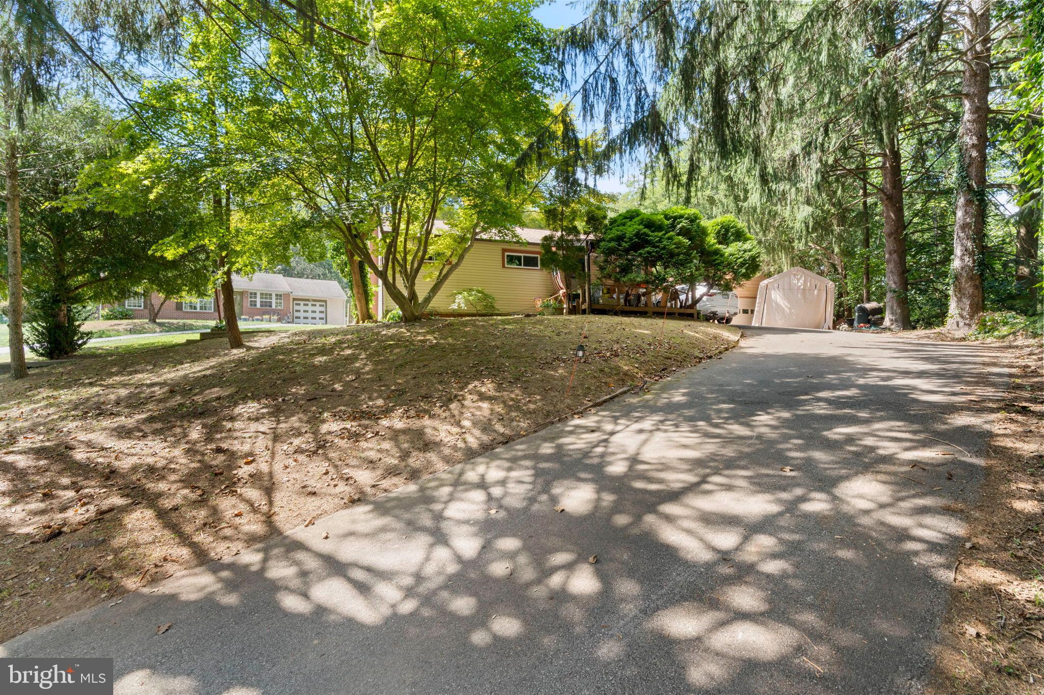 52 Carol Lane Malvern, PA 19355 - Photo 9 of 14 a view of a yard with plants and trees