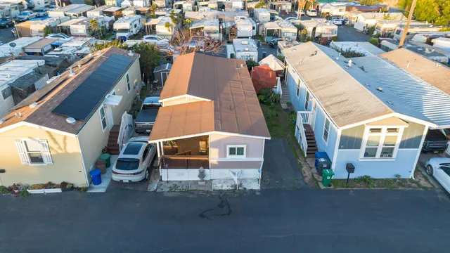 an aerial view of residential houses with outdoor space