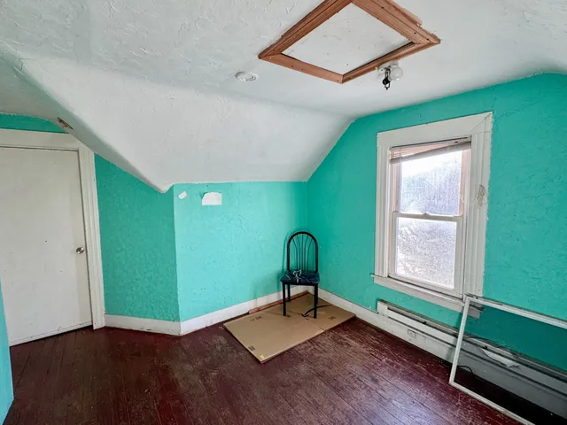 a room with window and wooden floors