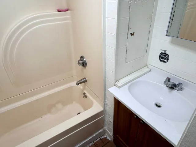 a bathroom with a sink and a bathtub