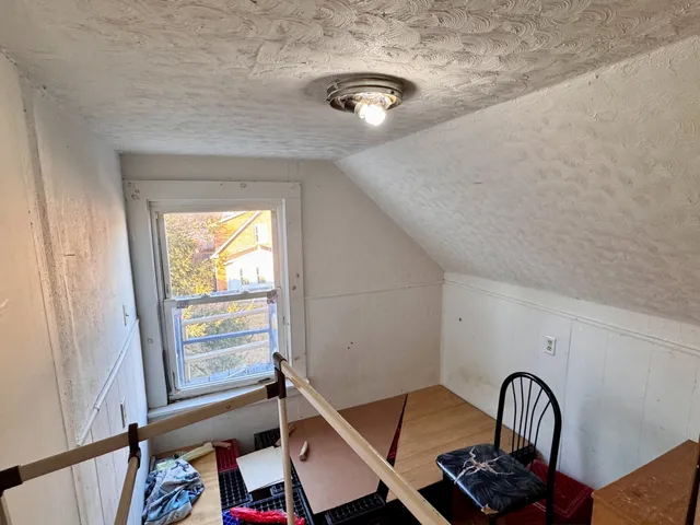 a view of an entryway with wooden floor