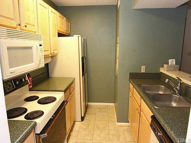 3702 Chimney Ridge Place, Unit 104 Durham, NC 27713 - Photo 4 of 12 This attractive kitchen has been completed renovated with new cabinets, new counters, new fixtures and a tiled floor!