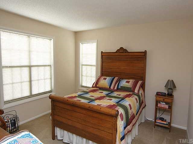 3702 Chimney Ridge Place, Unit 104 Durham, NC 27713 - Photo 5 of 12 This cozy master bedroom offers a large walk-in closet.