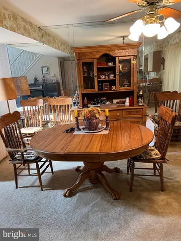 a swimming pool view with a outdoor seating