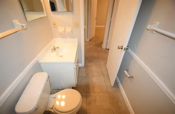 a bathroom with a toilet and a sink