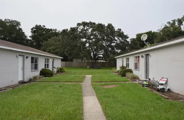a view of a house with a back yard