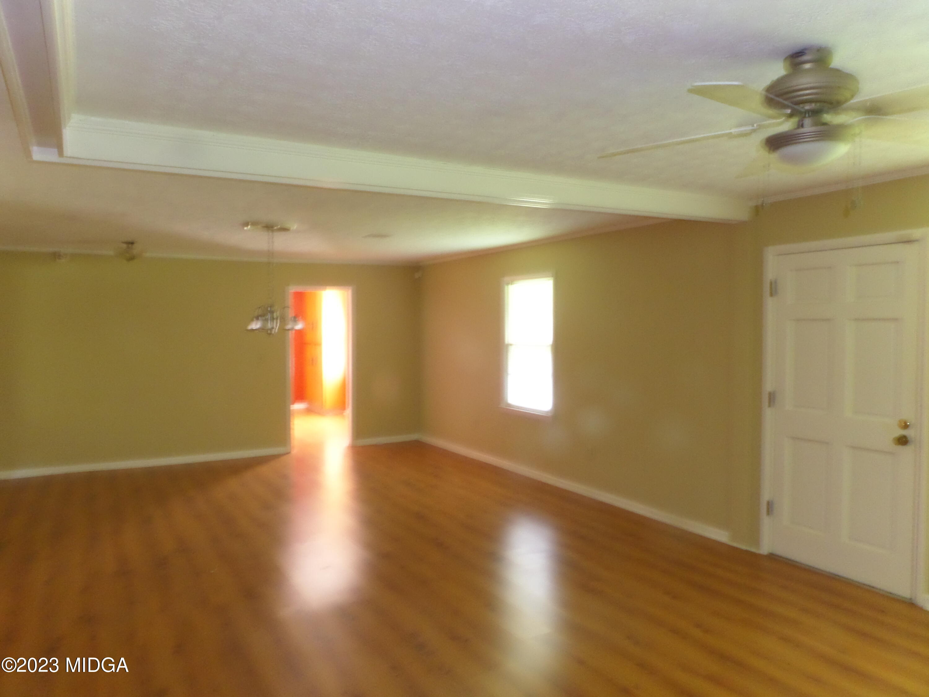 2816 Montpelier Station Road Musella, GA 31066 - Photo 3 of 9 a view of an empty room and window and wooden floor