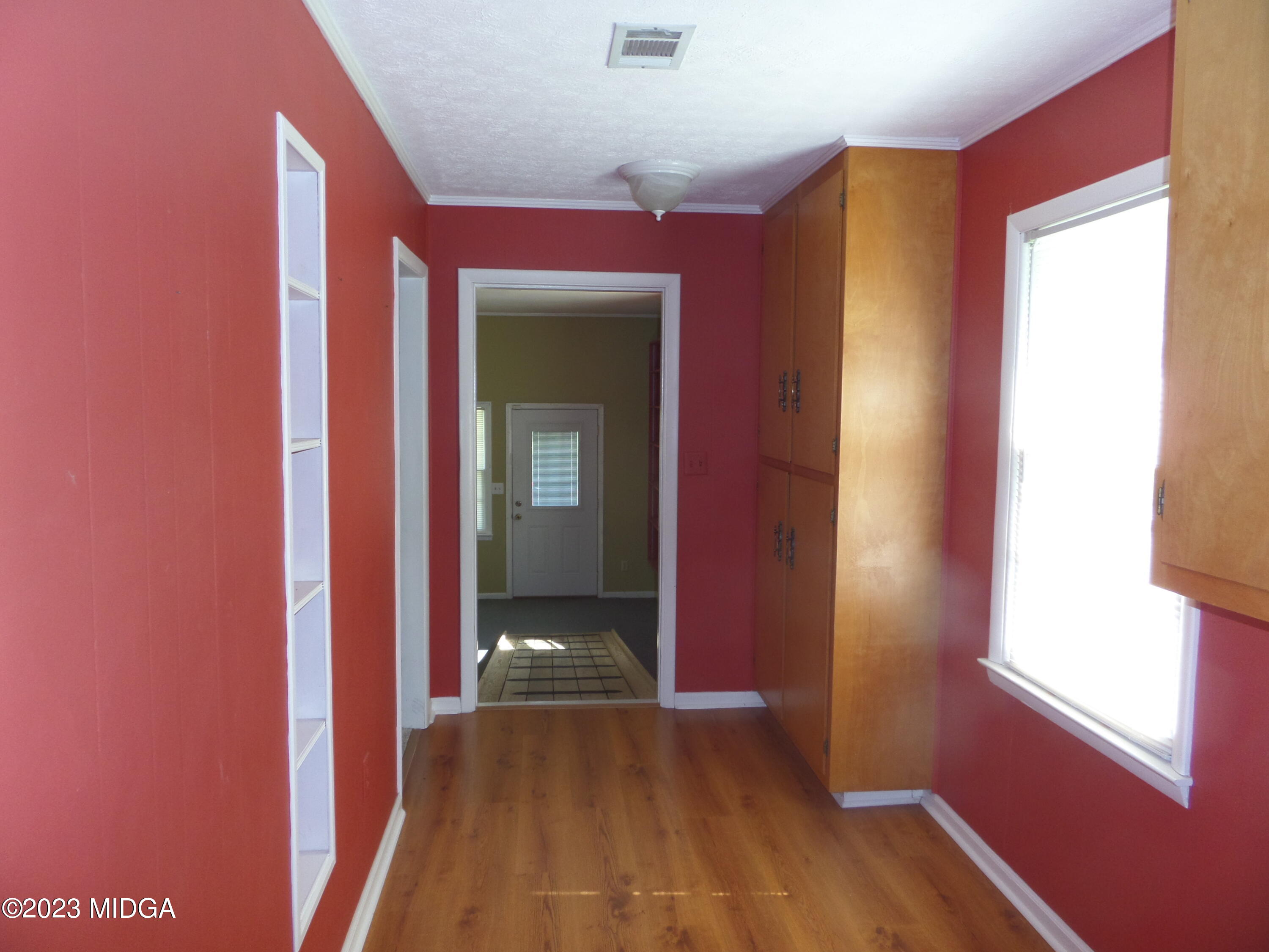 2816 Montpelier Station Road Musella, GA 31066 - Photo 5 of 9 a view of hallway with a large window and wooden floor