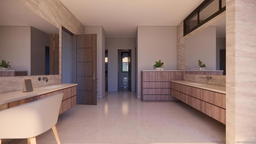 16256 Via Del Alba Rancho Santa Fe, CA 92067 - Photo 42 of 42 a large en suite bathroom with a double vanity sink a large mirror and a bathtub