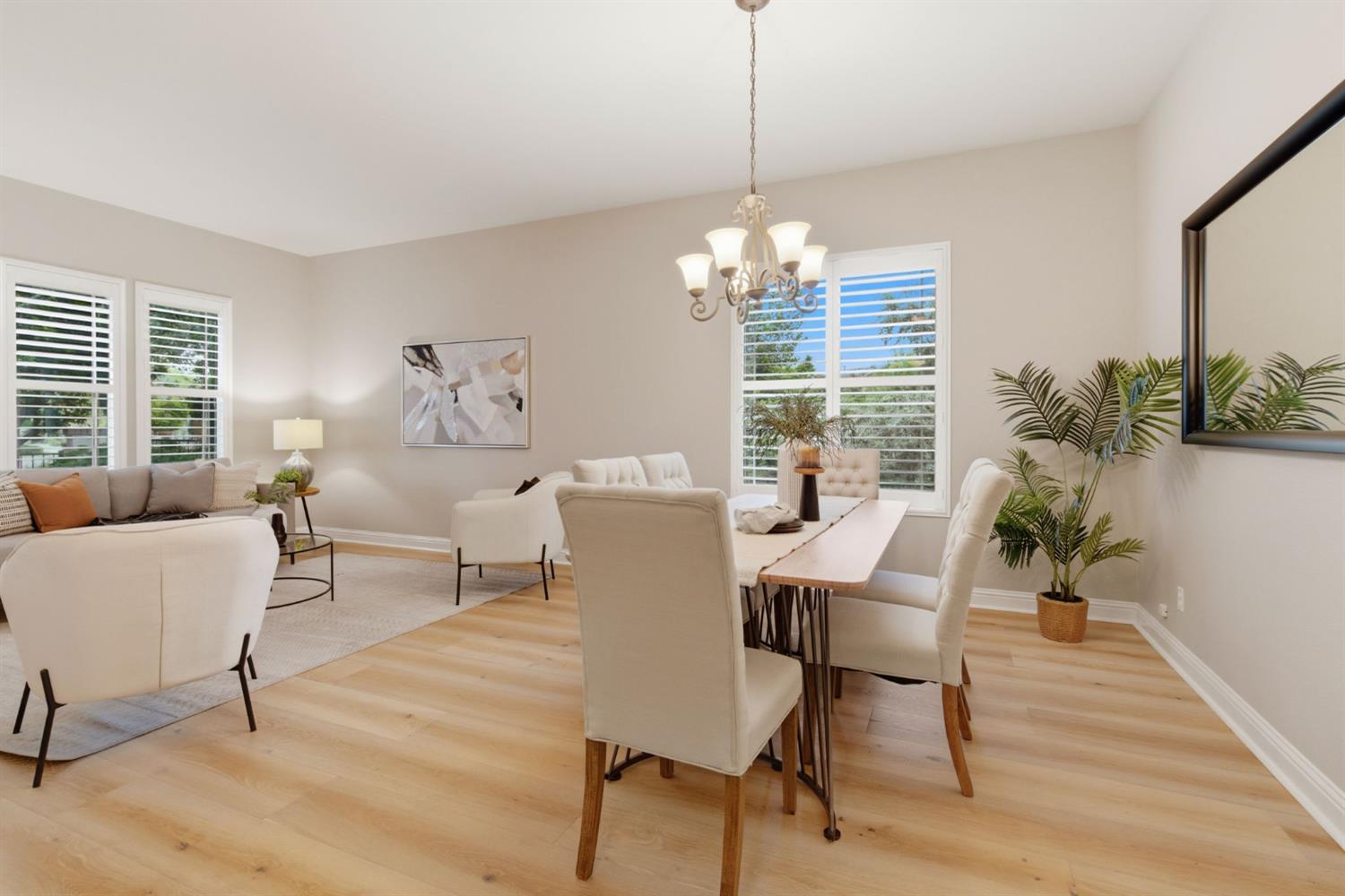 2499 Appleleaf Lane Manteca, CA 95336 - Photo 11 of 55 a view of a dining room with furniture window and wooden floor