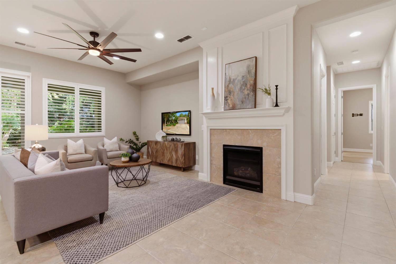 2499 Appleleaf Lane Manteca, CA 95336 - Photo 21 of 55 a living room with furniture and a fireplace