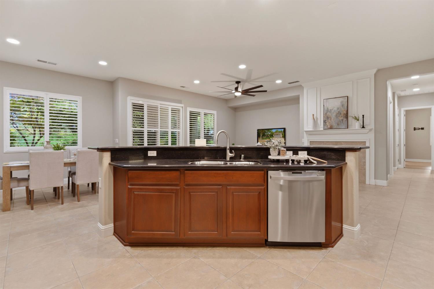 2499 Appleleaf Lane Manteca, CA 95336 - Photo 24 of 55 a kitchen with stainless steel appliances granite countertop a stove a sink and a refrigerator