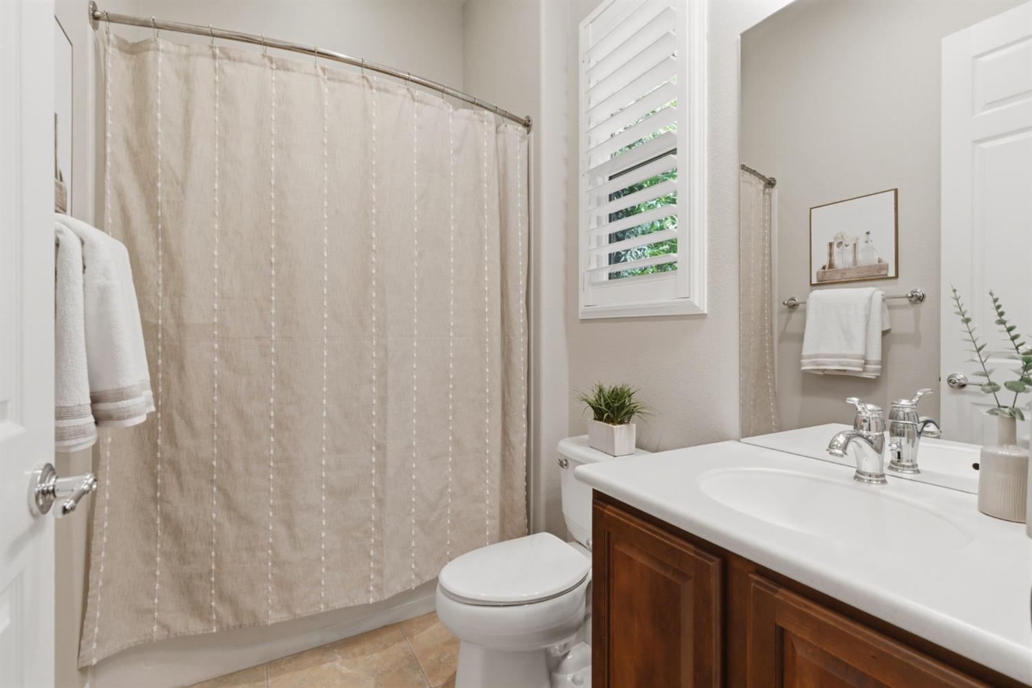 2499 Appleleaf Lane Manteca, CA 95336 - Photo 32 of 55 a bathroom with a granite countertop sink toilet and a mirror