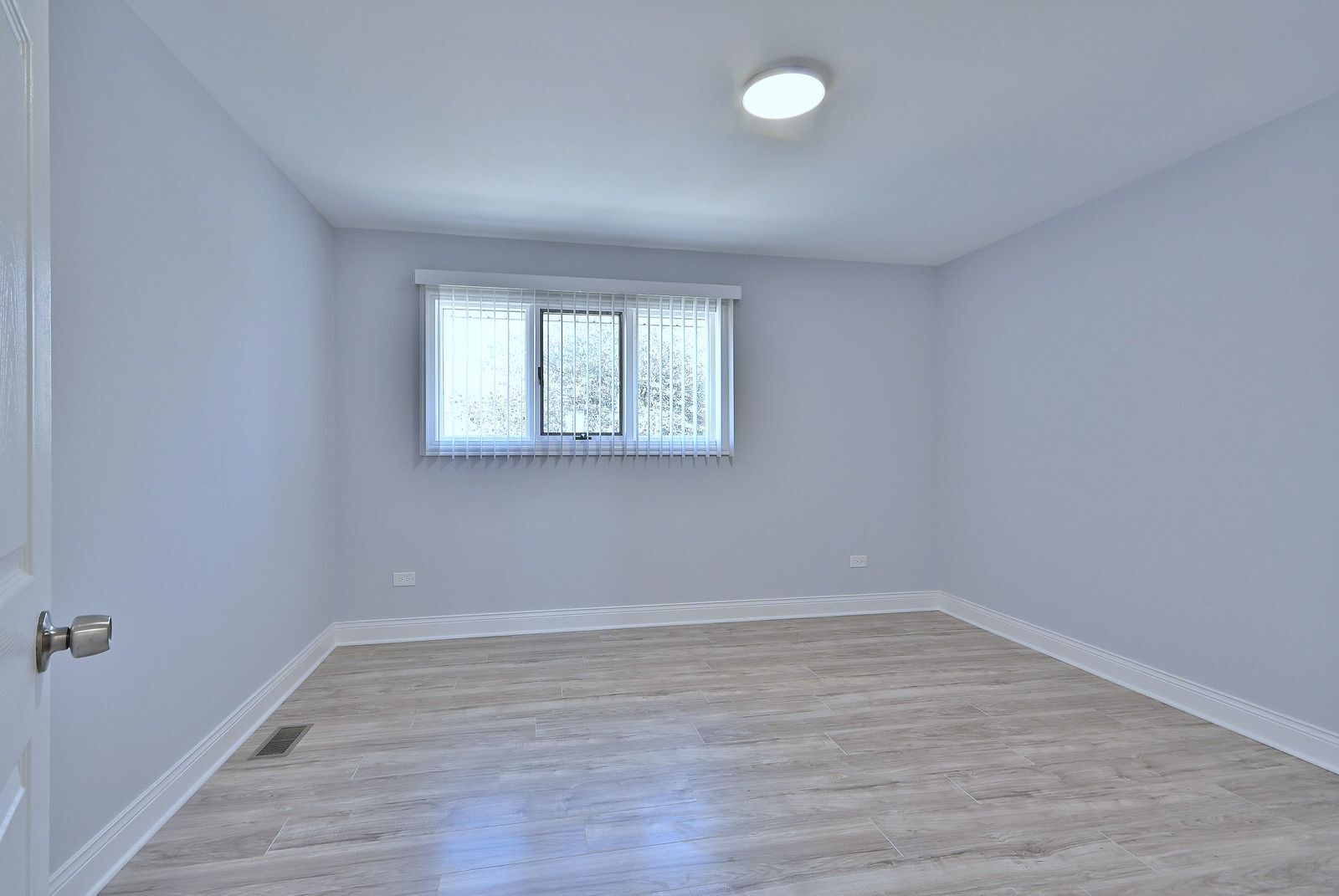 15262 74th Avenue, Unit 36 Orland Park, IL 60462 - Photo 13 of 25 wooden floor in an empty room with a window
