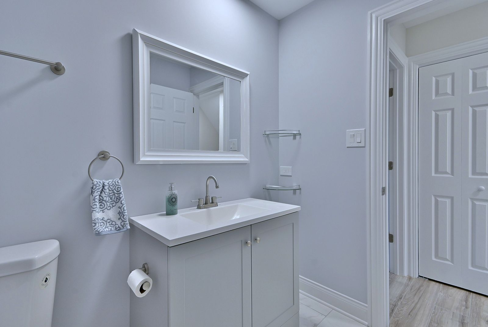 15262 74th Avenue, Unit 36 Orland Park, IL 60462 - Photo 17 of 25 a bathroom with a toilet sink and mirror