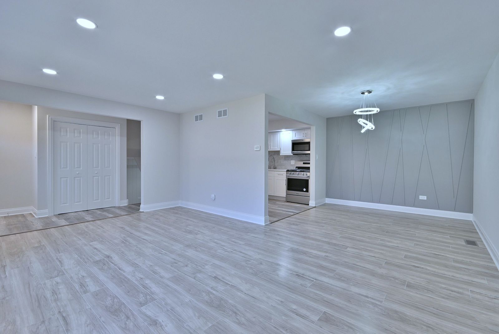 15262 74th Avenue, Unit 36 Orland Park, IL 60462 - Photo 4 of 25 an empty room with wooden floor closet and windows