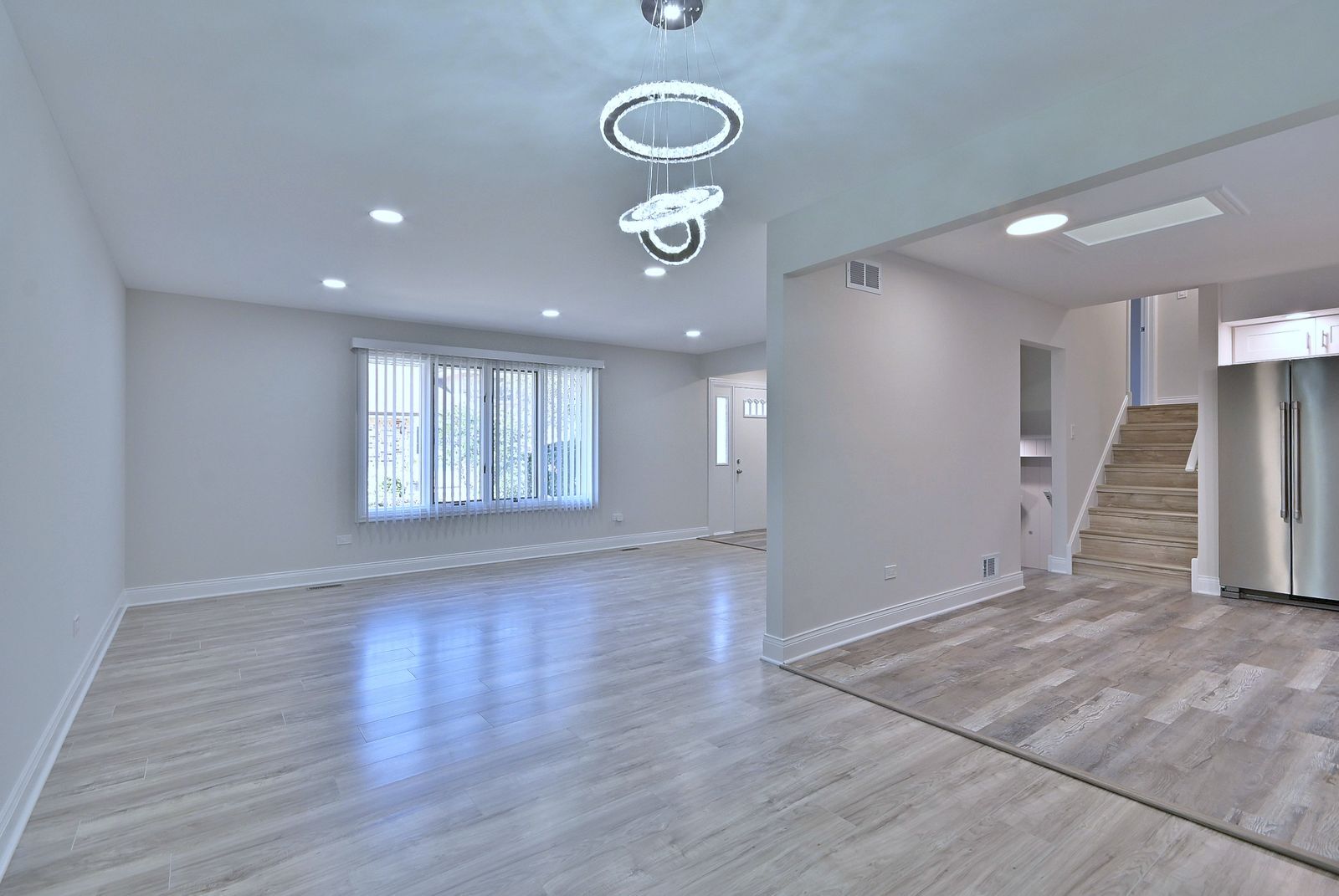 15262 74th Avenue, Unit 36 Orland Park, IL 60462 - Photo 6 of 25 an empty room with wooden floor and entryway