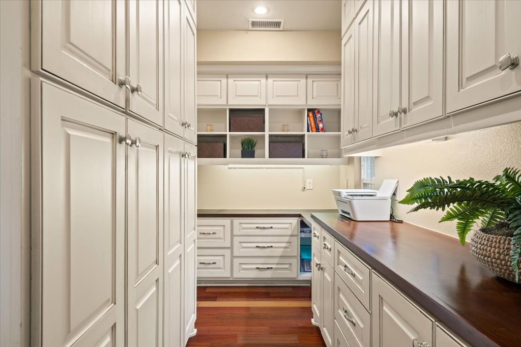 3803 Frodo Cove Austin, TX 78739 - Photo 14 of 40 a kitchen with stainless steel appliances a sink and cabinets