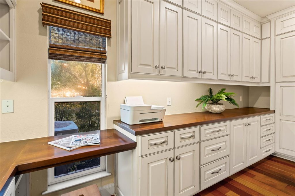 3803 Frodo Cove Austin, TX 78739 - Photo 15 of 40 a kitchen with stainless steel appliances white cabinets and a window