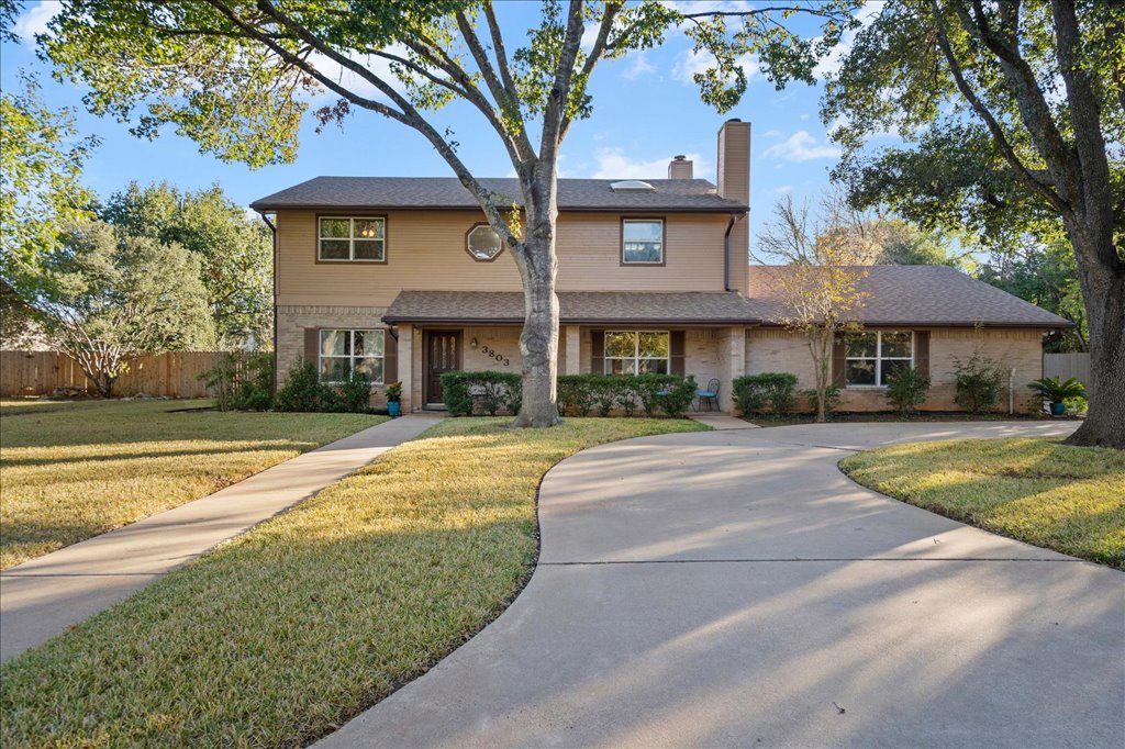 3803 Frodo Cove Austin, TX 78739 - Photo 2 of 40 a front view of a house with a yard