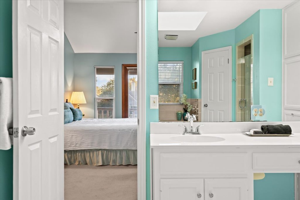 3803 Frodo Cove Austin, TX 78739 - Photo 24 of 40 a bathroom with a sink and a mirror