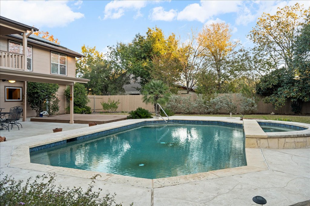3803 Frodo Cove Austin, TX 78739 - Photo 26 of 40 a view of a swimming pool with a patio