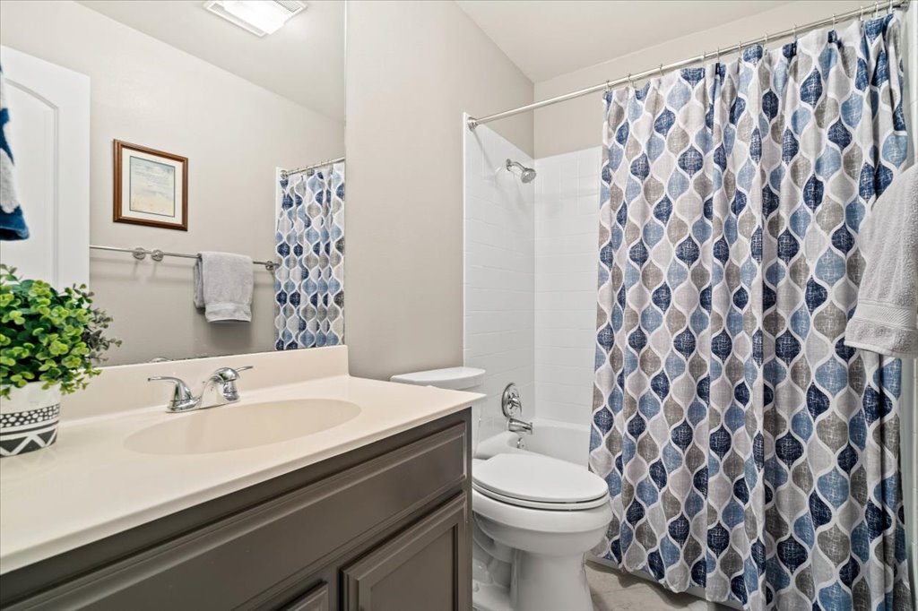 3803 Frodo Cove Austin, TX 78739 - Photo 28 of 40 a bathroom with a sink and a mirror