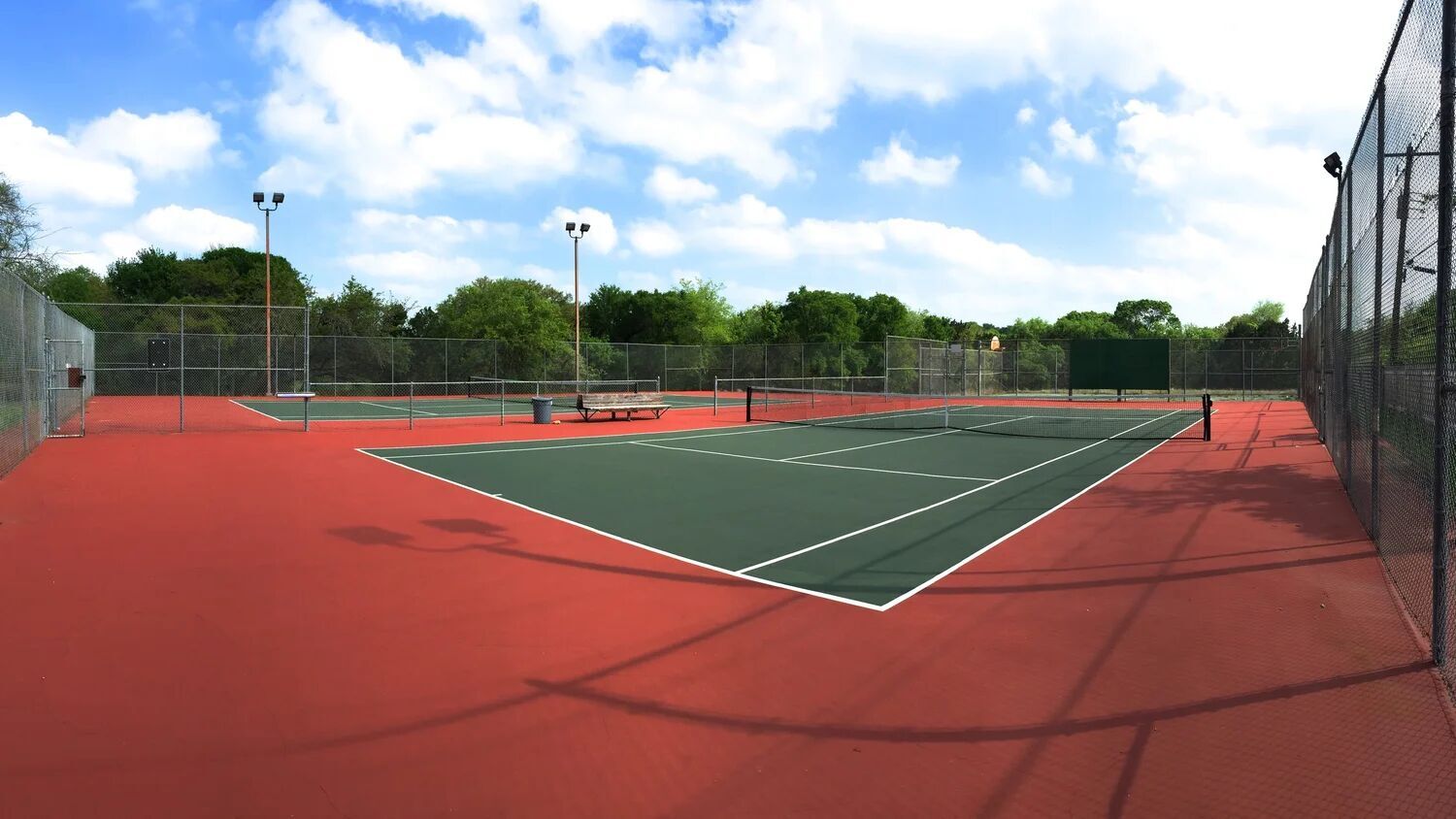 3803 Frodo Cove Austin, TX 78739 - Photo 38 of 40 a tennis court with view of trees in the background