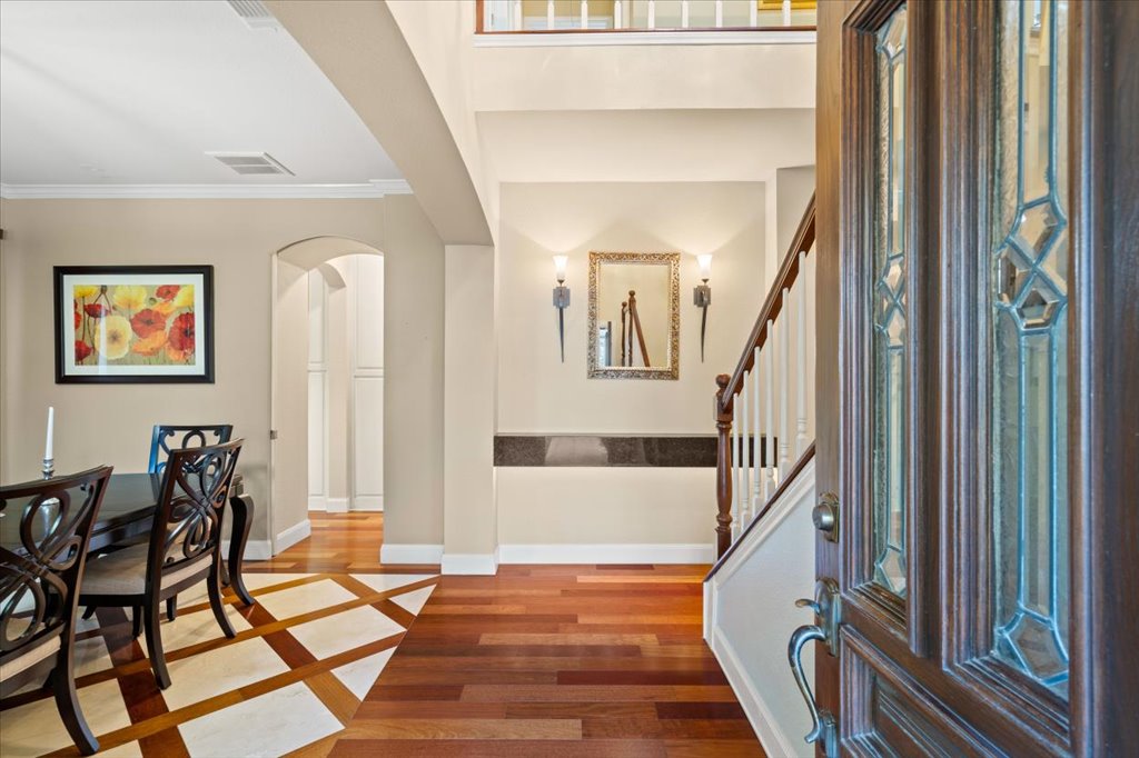 3803 Frodo Cove Austin, TX 78739 - Photo 4 of 40 a view of a hallway with wooden floor and staircase