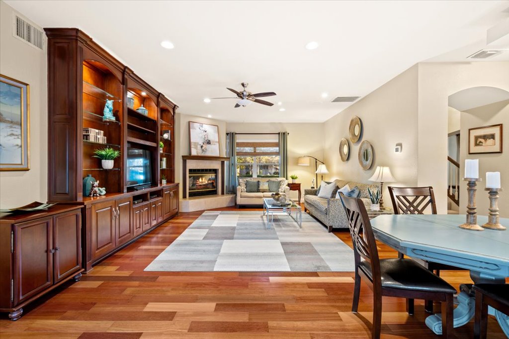 3803 Frodo Cove Austin, TX 78739 - Photo 5 of 40 a living room with furniture a dining table and a large window with wooden floor