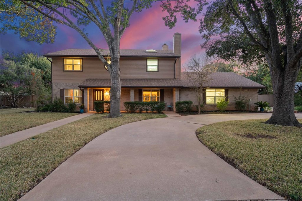 3803 Frodo Cove Austin, TX 78739 - Photo 6 of 40 a front view of a house with yard