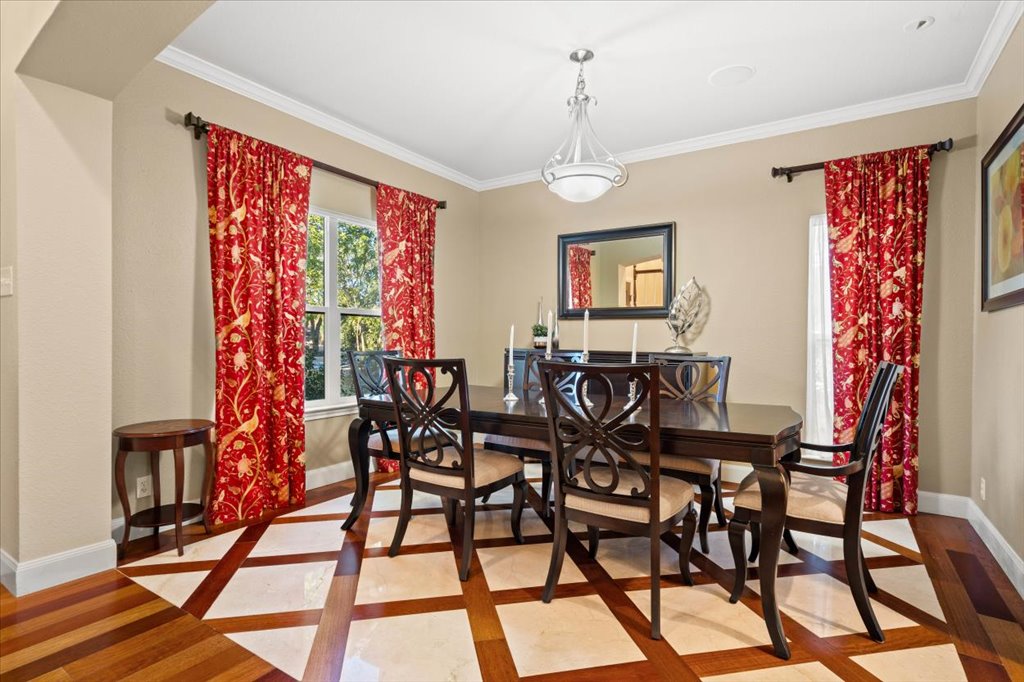 3803 Frodo Cove Austin, TX 78739 - Photo 8 of 40 a view of a dining room with furniture and chandelier