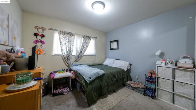 a bedroom with bed and a window