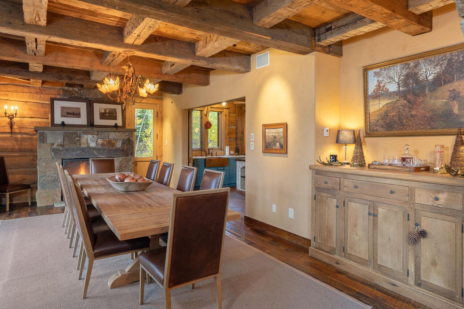 274 Benchmark Drive Mountain Village, CO 81435 - Photo 13 of 58 a dining room with furniture a fireplace and wooden floor