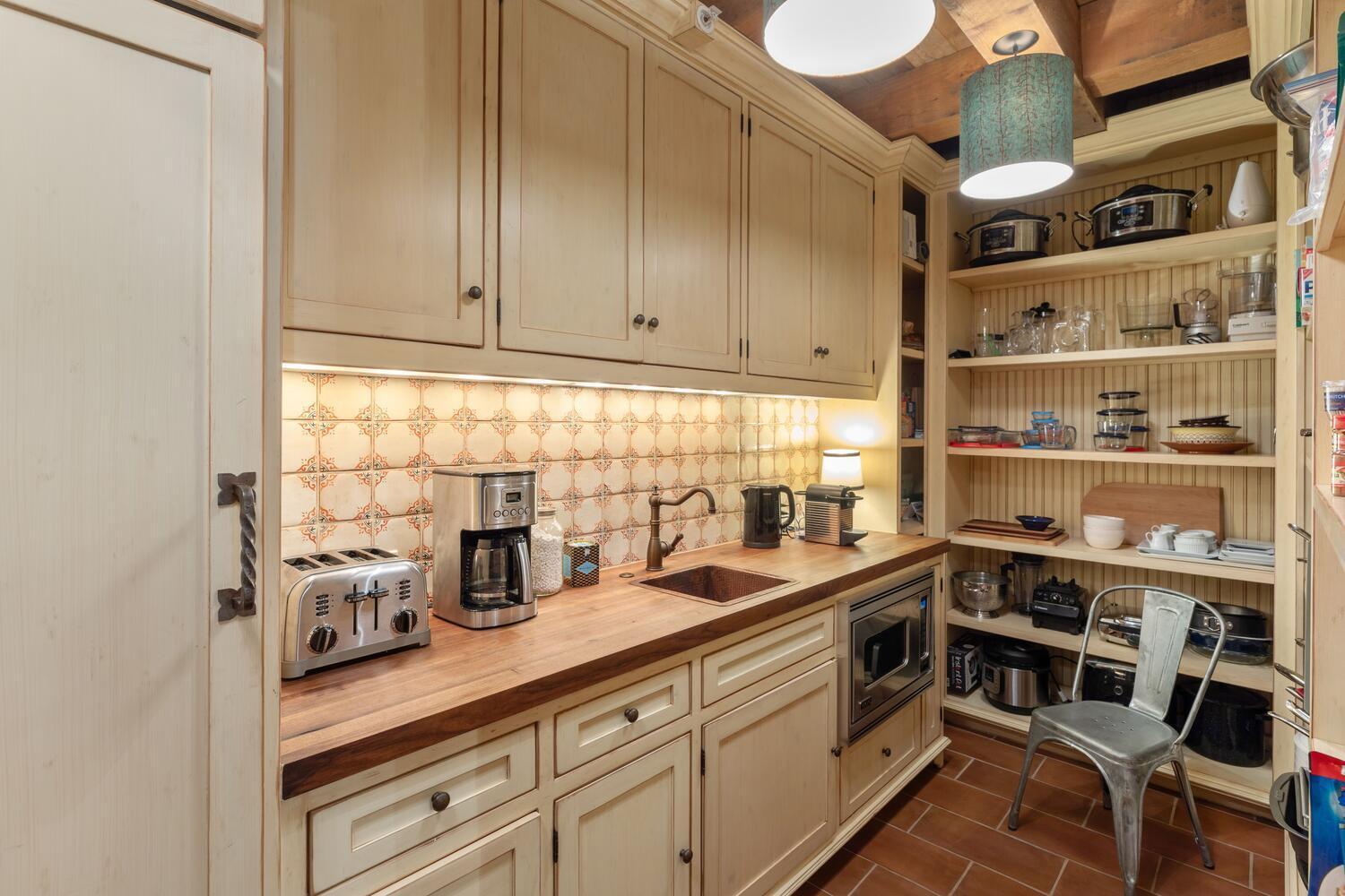 274 Benchmark Drive Mountain Village, CO 81435 - Photo 21 of 58 a kitchen with stainless steel appliances a sink and cabinets