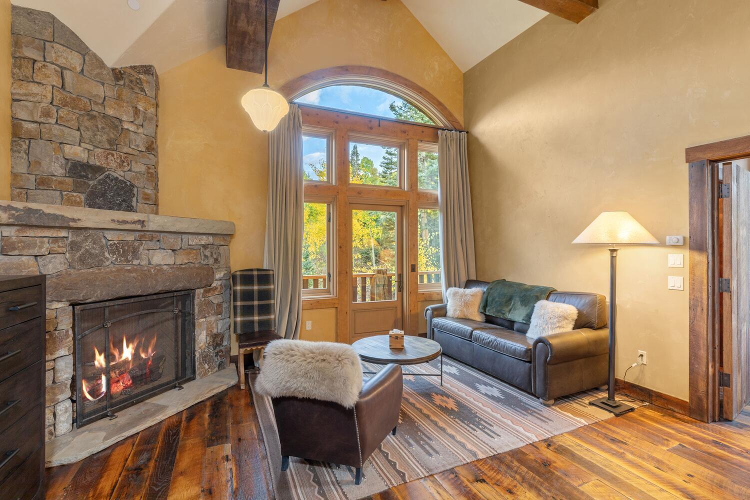 274 Benchmark Drive Mountain Village, CO 81435 - Photo 41 of 58 a living room with furniture and a fireplace