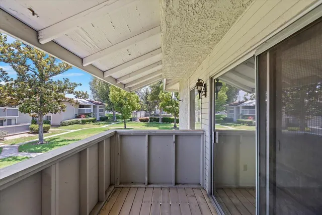 a kitchen with a sink and wooden floor