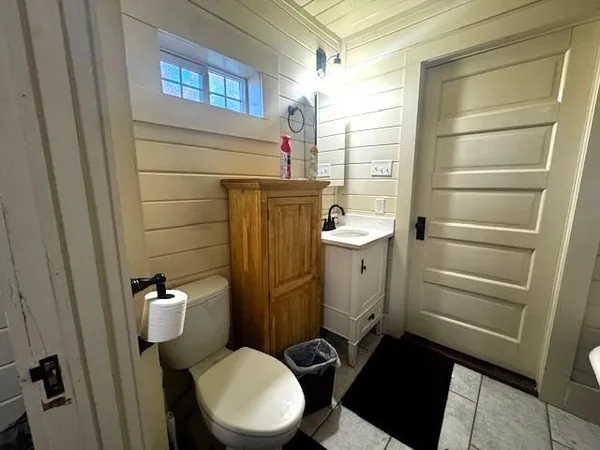 a bedroom with a bed and a television