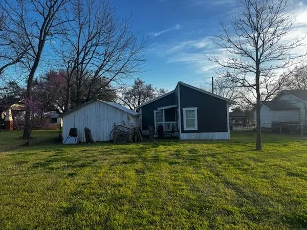 a view of a house with a door and wooden floor