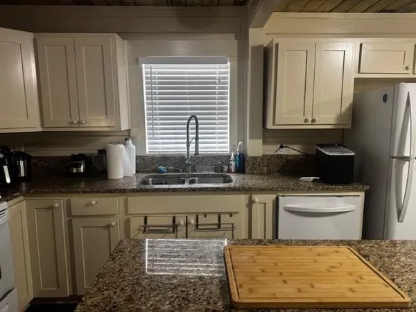 a view of a room with wooden floor and staircase