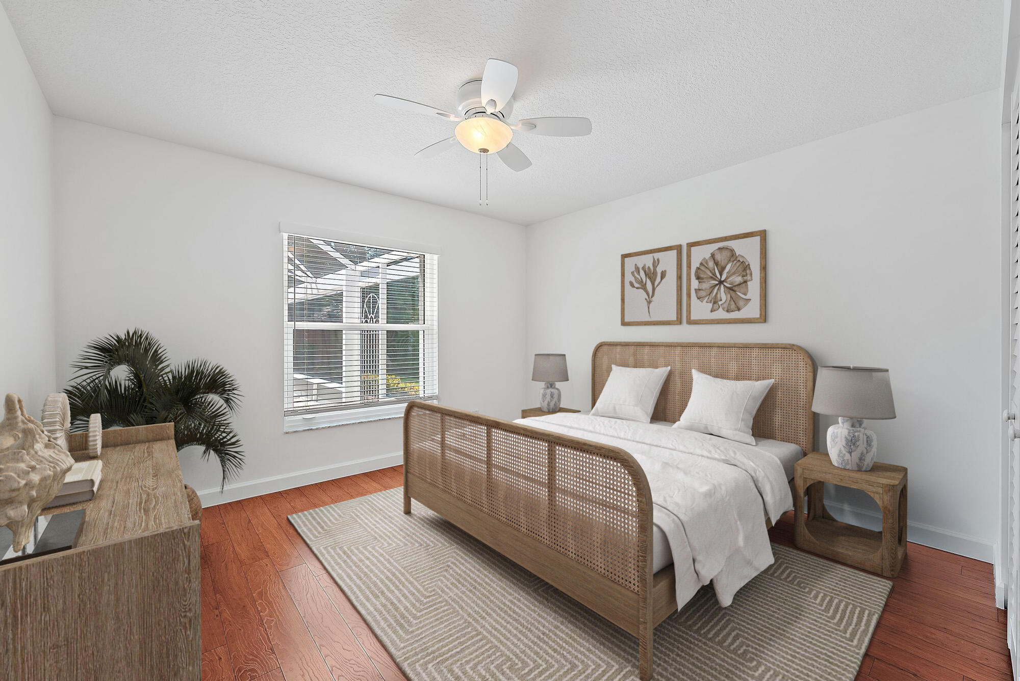 12 Bentwood Road Palm Beach Gardens, FL 33418 - Photo 19 of 40 a spacious bedroom with a bed and wooden floor