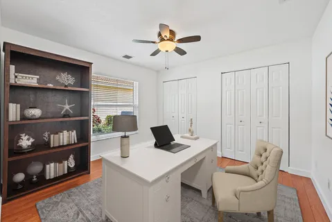 a living room with furniture a rug and a window