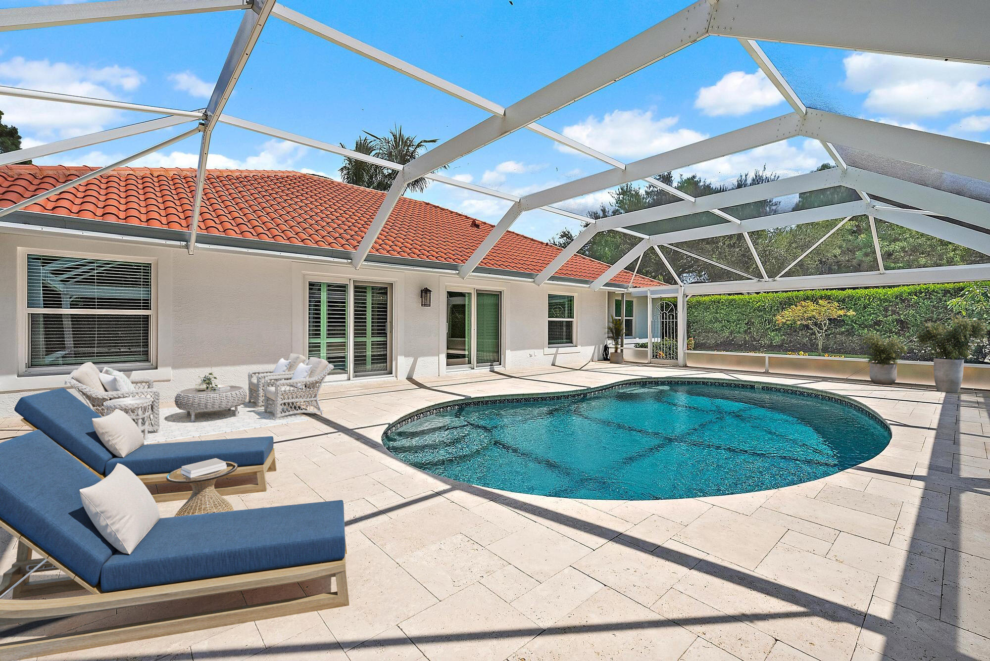 12 Bentwood Road Palm Beach Gardens, FL 33418 - Photo 25 of 40 a view of patio with a table and chairs under an umbrella