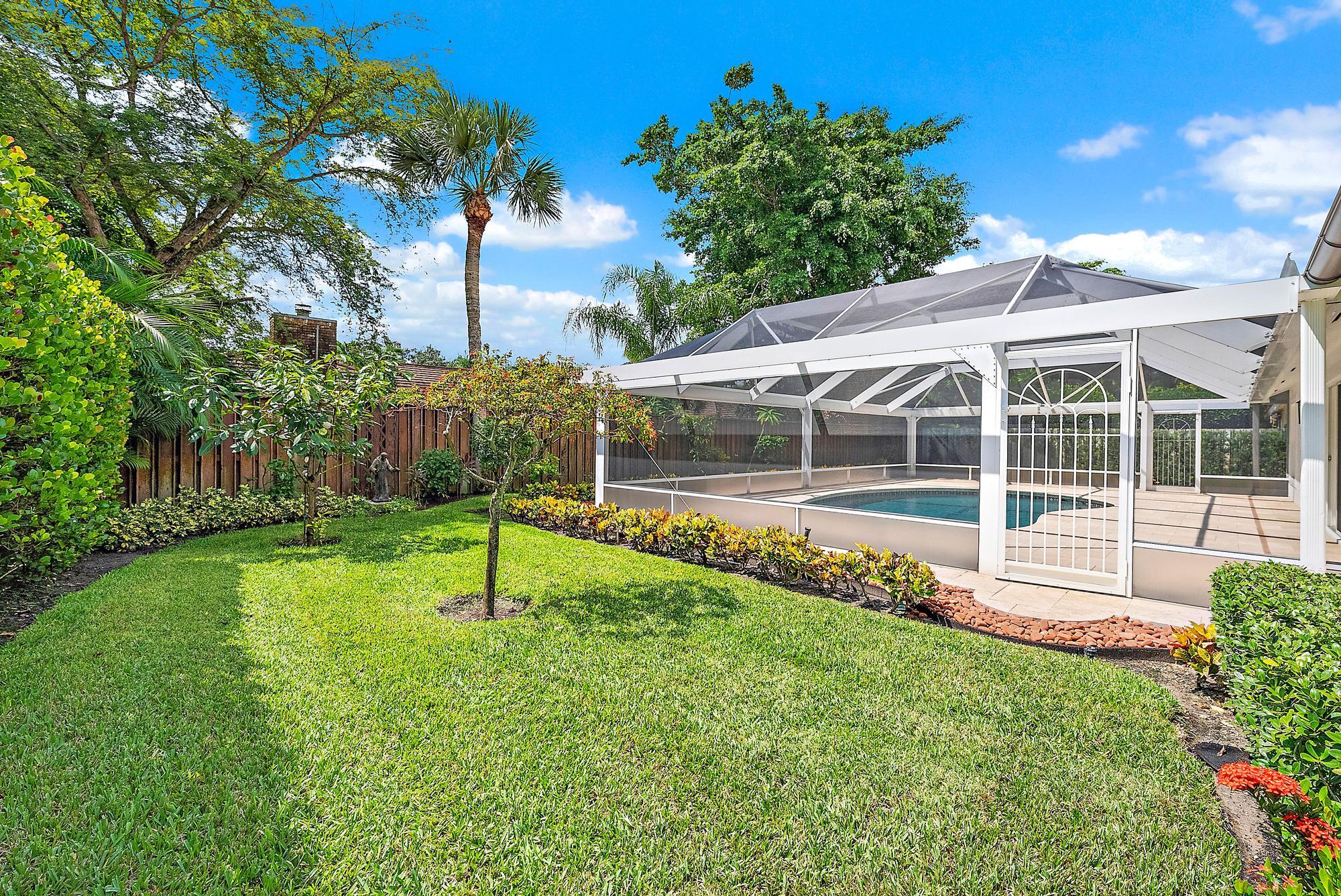 12 Bentwood Road Palm Beach Gardens, FL 33418 - Photo 28 of 40 a view of house with a backyard