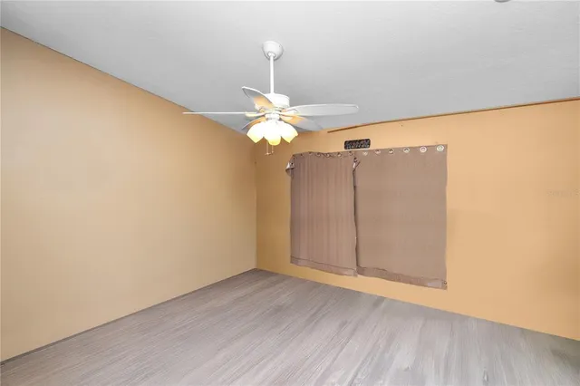 a view of a livingroom with wooden floor