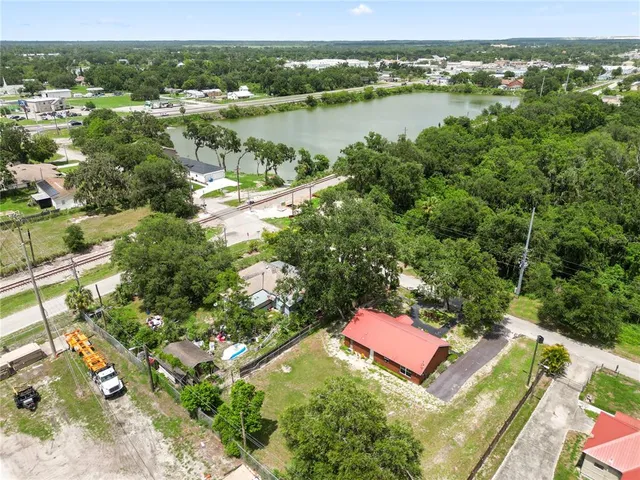 an aerial view of a house with a garden and swimming pool