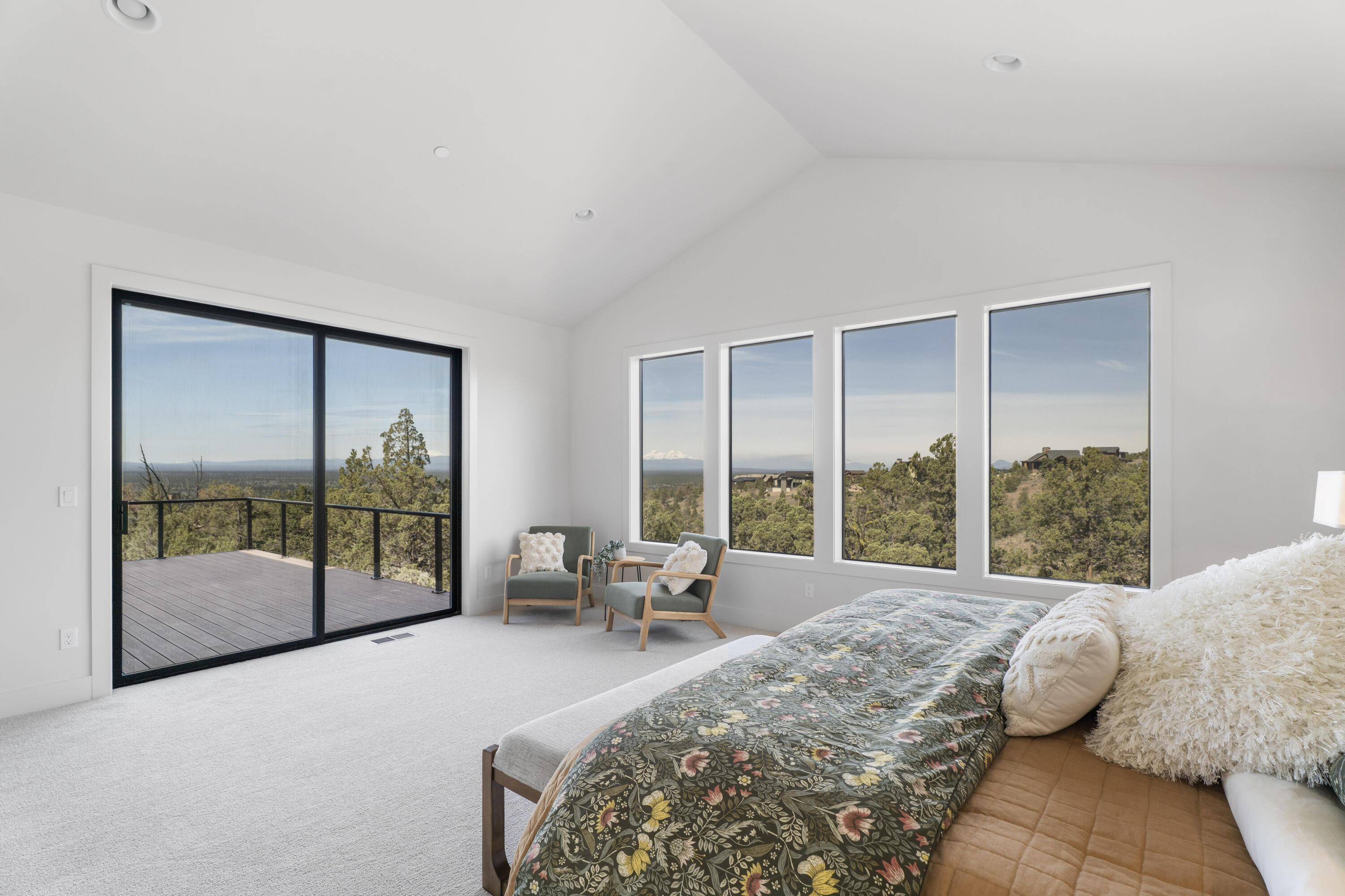 16883 Southwest Paragon Court Powell Butte, OR 97753 - Photo 15 of 42 The primary suite frames Cascade Mountain views with privacy among the junipers