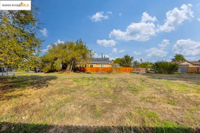 a view of yard with swimming pool
